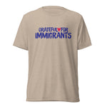 Beige t-shirt with 'Grateful for Immigrants' text on a white background