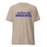 Beige t-shirt with 'Grateful for Immigrants' text on a white background