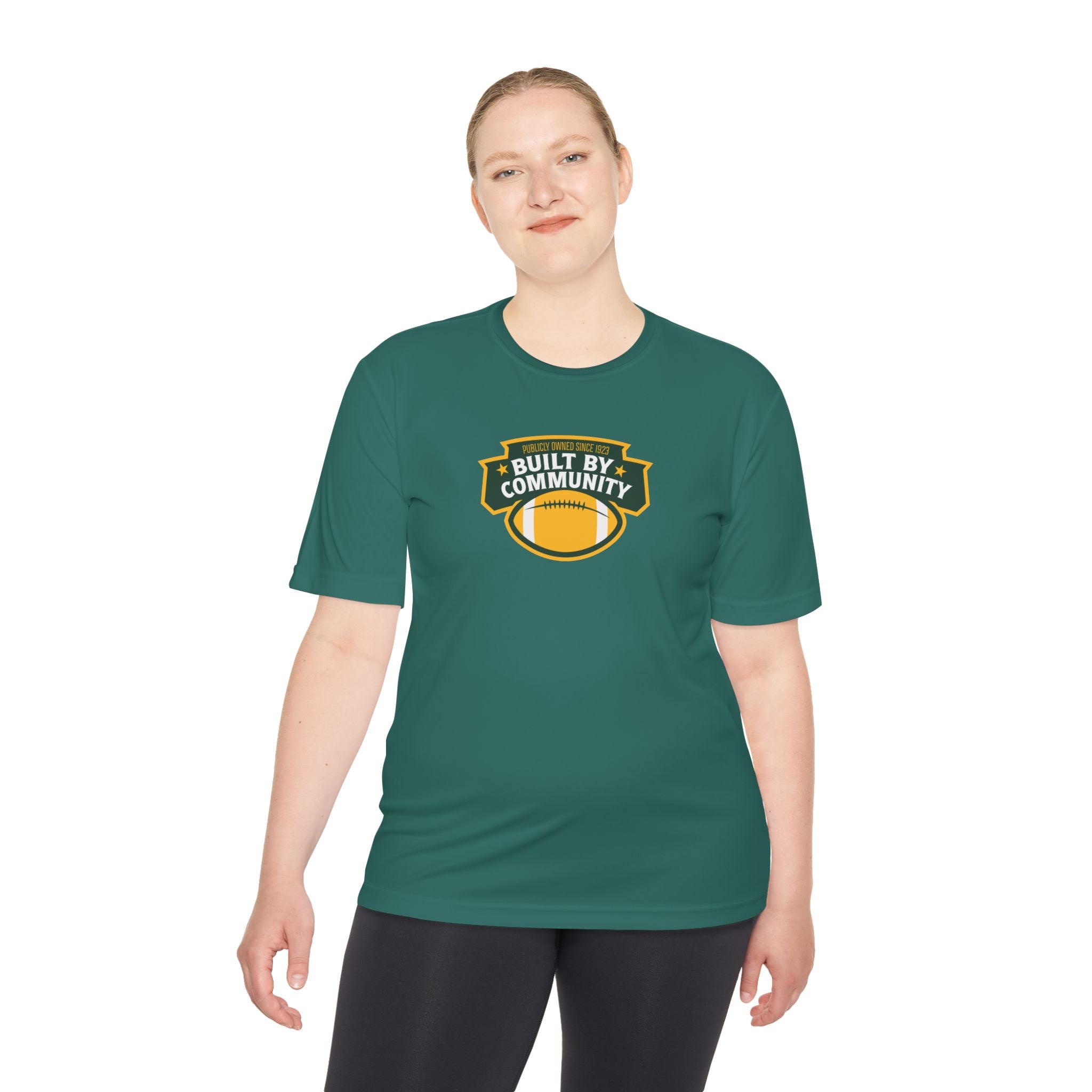 Person wearing a green t-shirt with a logo and text on a white background