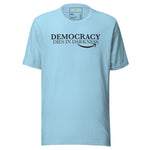 Light blue t-shirt with 'Democracy Dies in Darkness' text on a white background