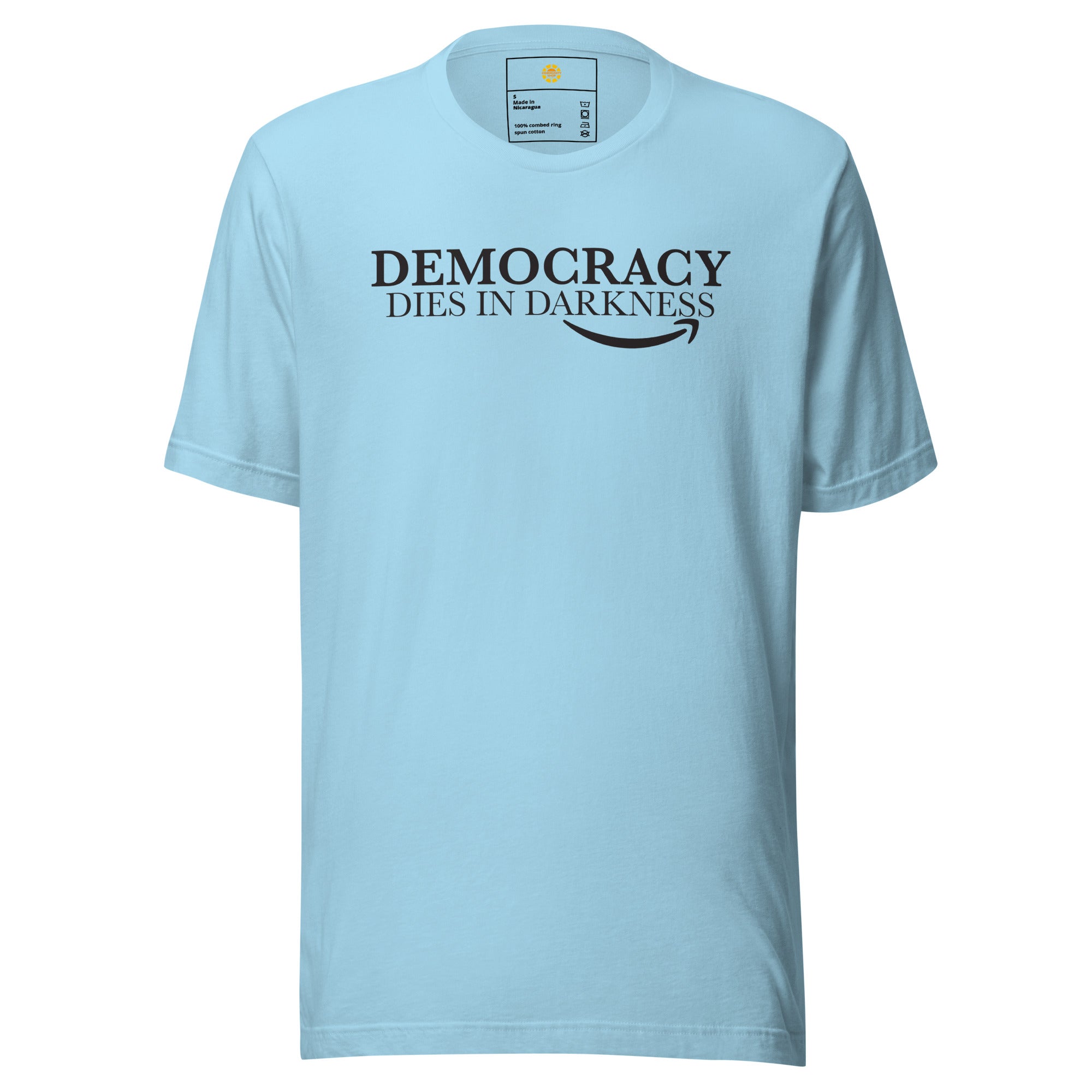 Light blue t-shirt with 'Democracy Dies in Darkness' text on a white background