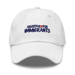 White cap with 'Grateful for Immigrants' text on a white background