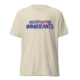 Beige t-shirt with 'Grateful for Immigrants' text on a white background