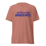 Red t-shirt with 'Grateful for Immigrants' text on a white background
